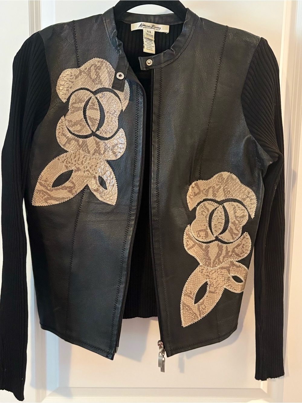 Katherine Barclay Black Leather Jacket with Beige Floral Appliqués knit sleeves